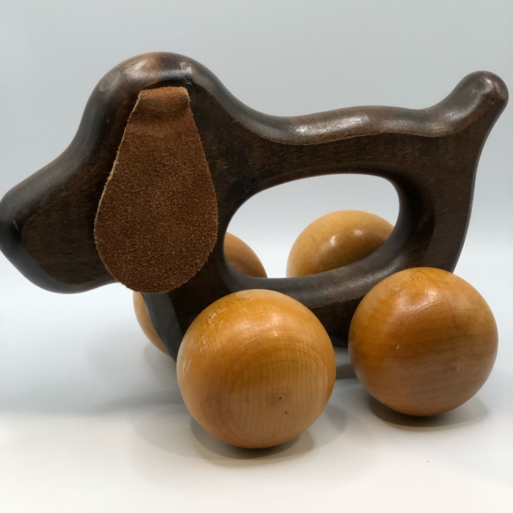 Vintage dog on wheels toy